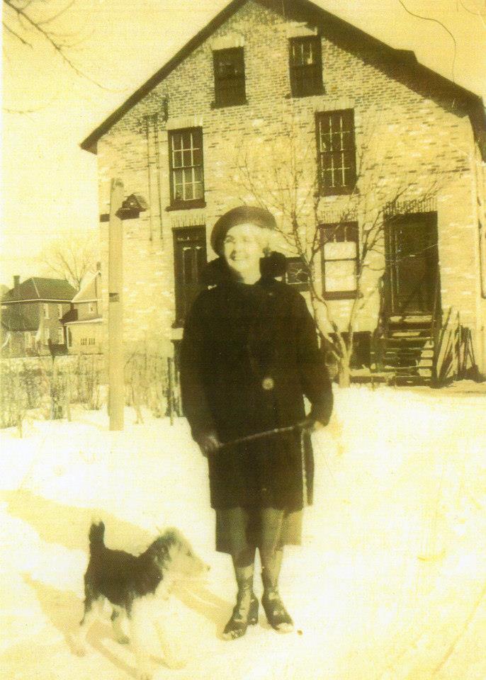 Mabel Campbell and Skippy in front of the Factory.