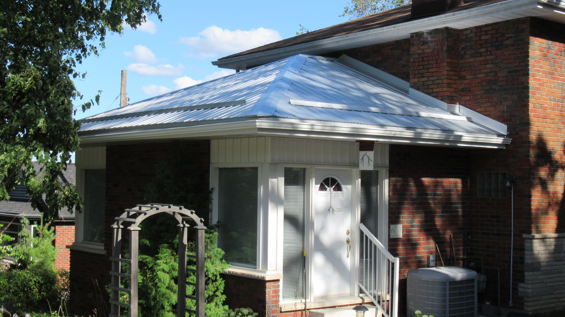 Photo of a finished, sloped metal roof
